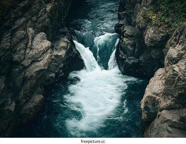 Close Up of Fast Flowing Water Through Rocks