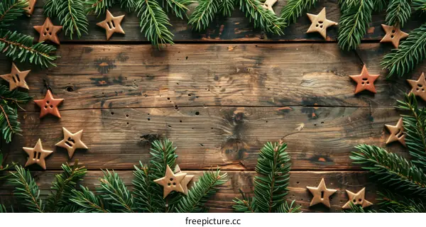 Rustic Christmas background with fir branches and handmade wooden stars