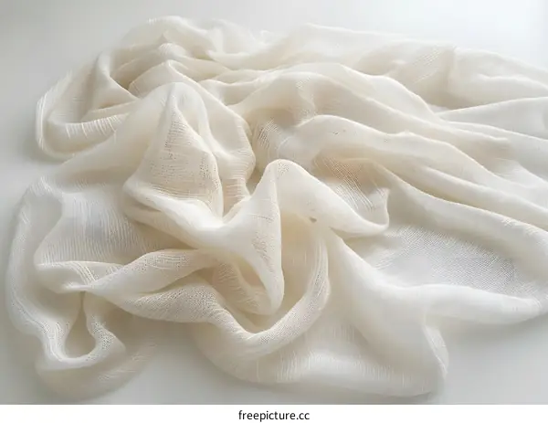 White delicate fabric texture on white background