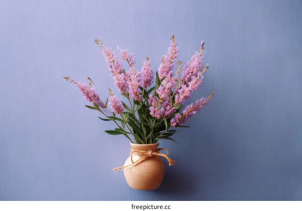 Pink Flowers in a Vase on a Pastel Background