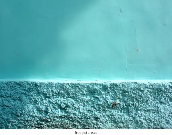 Teal Painted Wall with Textured Base