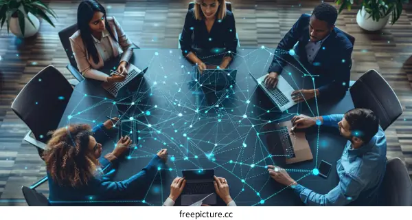 Multiethnic business team using digital devices at a conference table