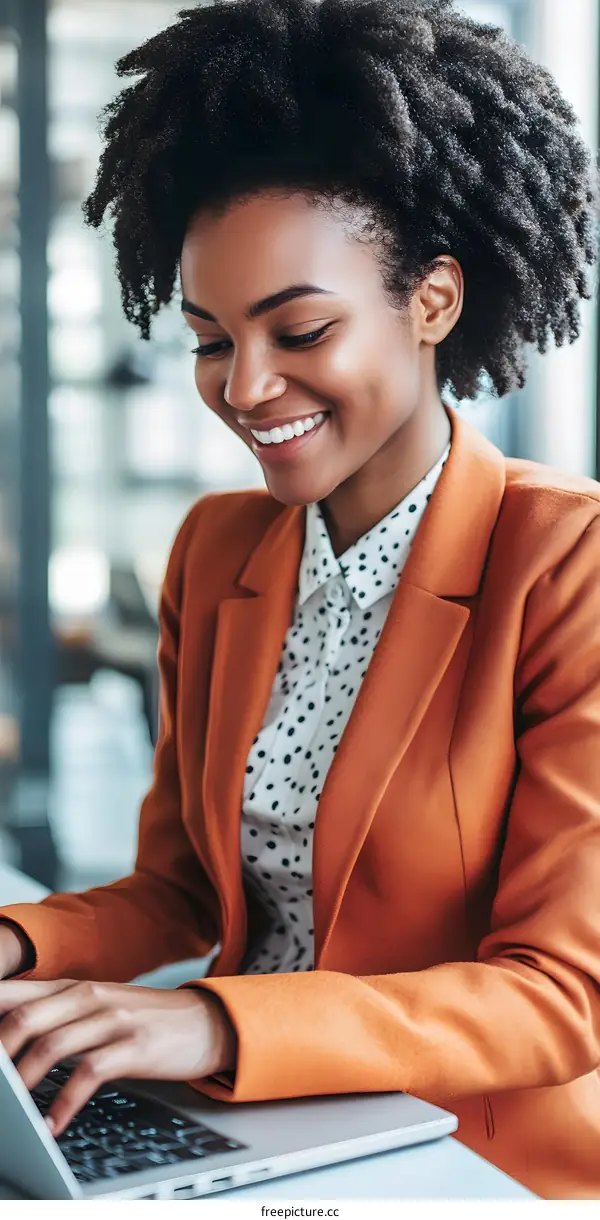 Smiling African American Woman Working on Laptop