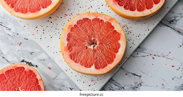 Fresh Sliced Grapefruit On Marble Background