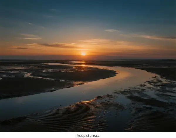 Beautiful Sunset Over a Winding River in the Evening