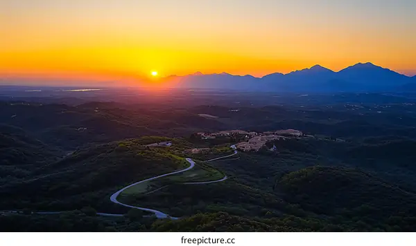 Sunset Over Mountainous Landscape