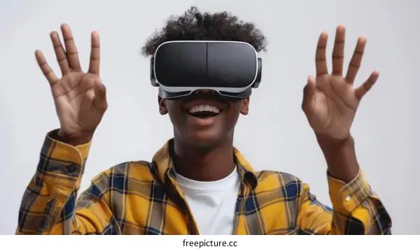African American man wearing virtual reality headset and smiling