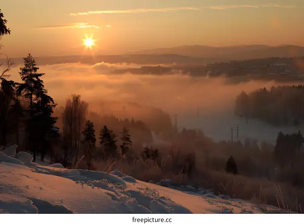 Winter Sunrise Over a Foggy Valley