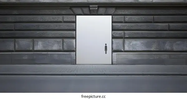 Grey Brick Wall with White Door and Male Symbol