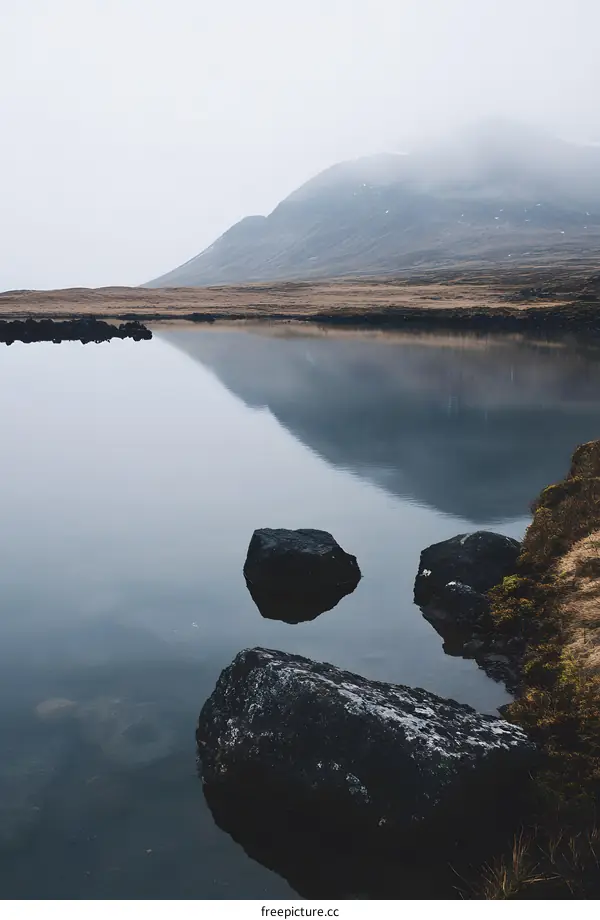 Misty Mountain Reflected in Still Water