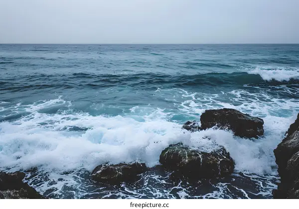 Ocean Waves Crashing on Rocky Shore