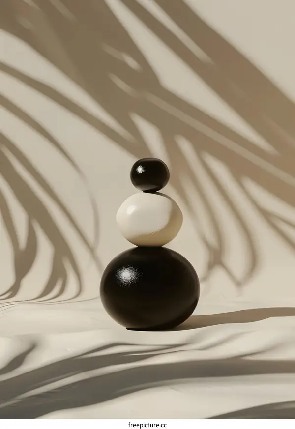 Minimalist Stack of Spheres with Palm Leaf Shadow