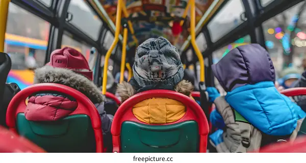 People in Winter Clothing Riding on a Bus