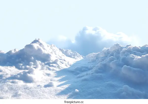 Winter Snowdrift Landscape with Sunlit Clouds