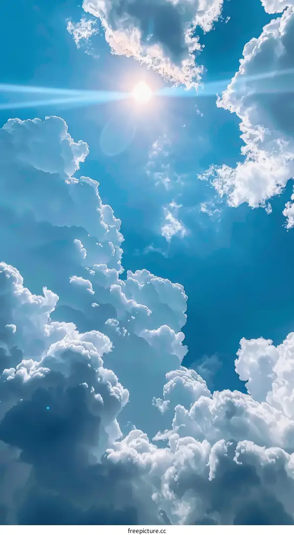 Serene Blue Sky with Fluffy White Clouds