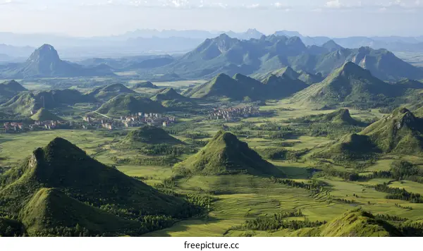 Panoramic Landscape of Mountainous Valley with Lush Green Terrain