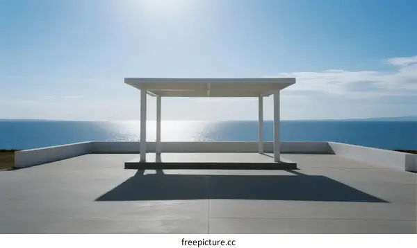 A White Pavilion Overlooking a Vast Blue Ocean