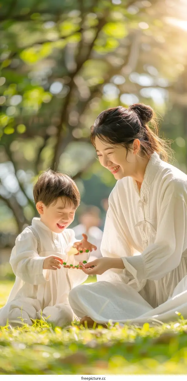 A mother and her son are playing in the park.