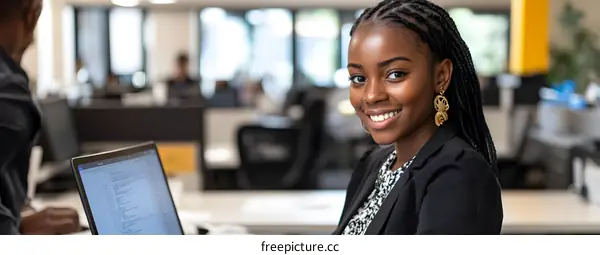 Smiling Black Woman In Modern Office Setting