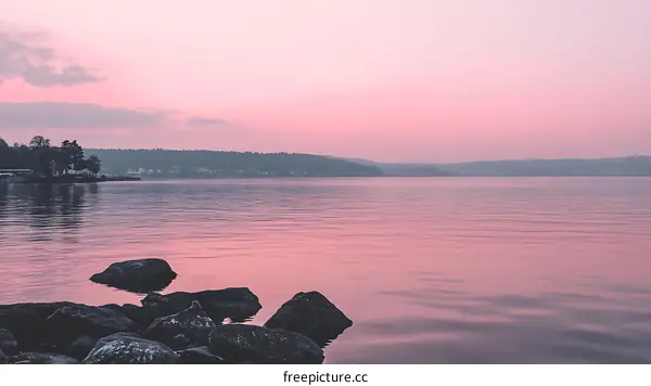Pink Sunset Sky Over Still Lake Water