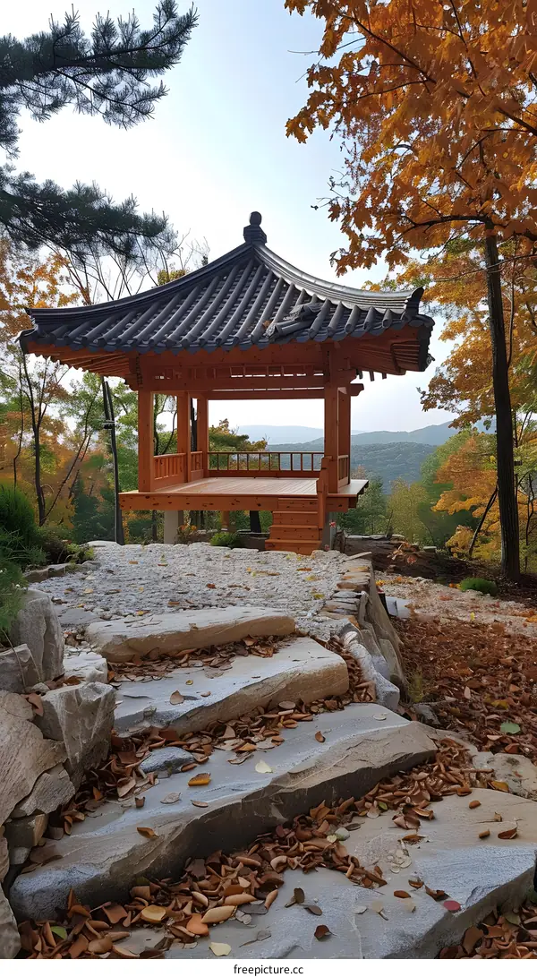 Traditional Korean Pavilion with Stone Steps in Autumn Foliage