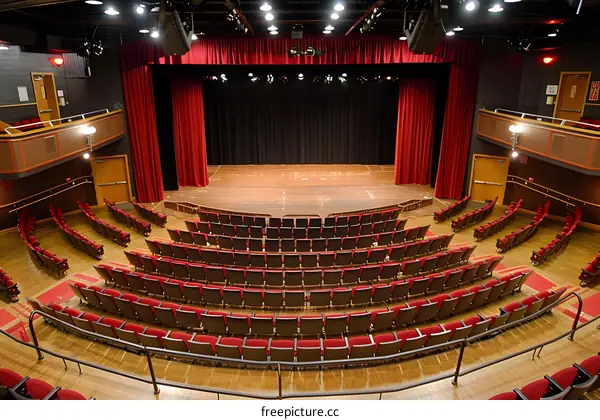 Empty Auditorium with Red Seats and Stage