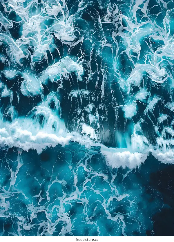 Aerial View of Ocean Waves Crashing