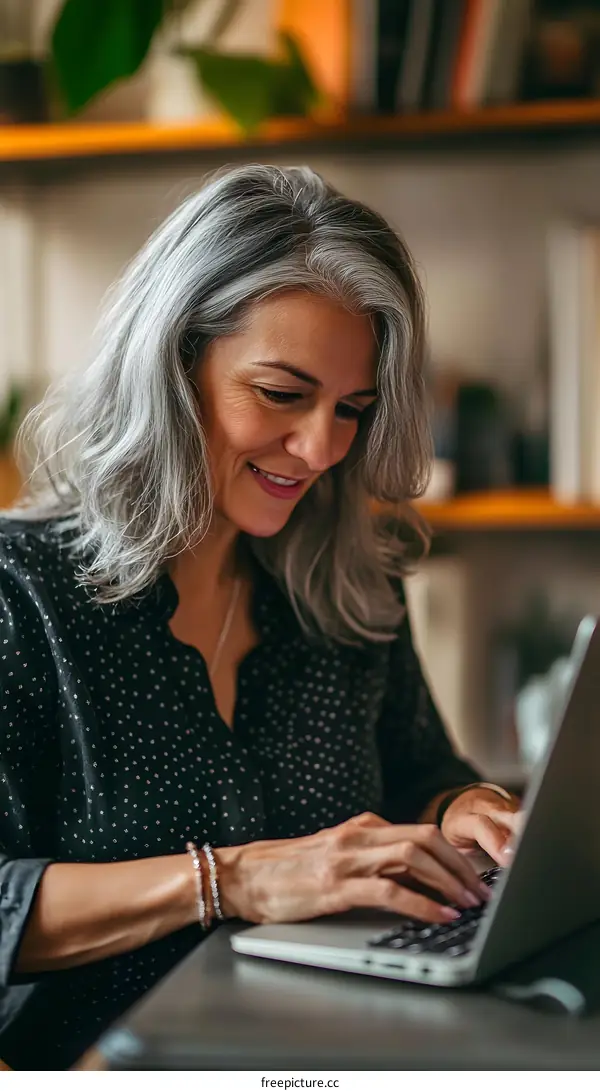 Smiling Woman Working on Laptop At Home