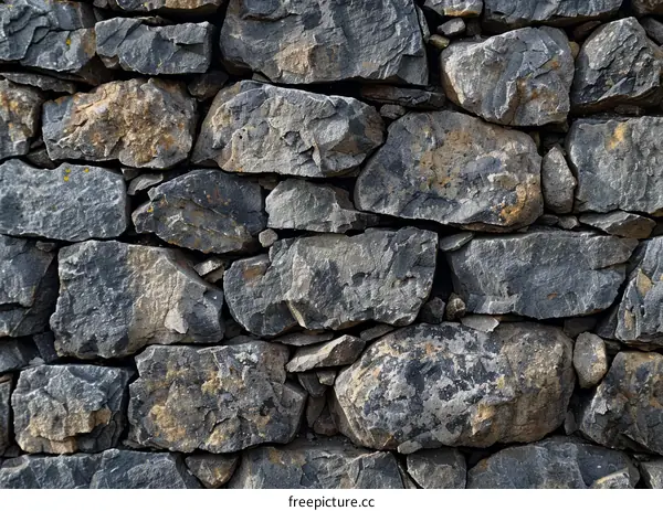 Rough dark grey stone wall texture background