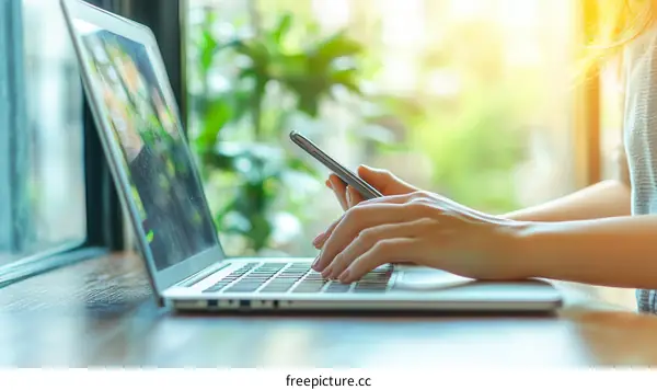 Woman Working on Laptop and Smartphone