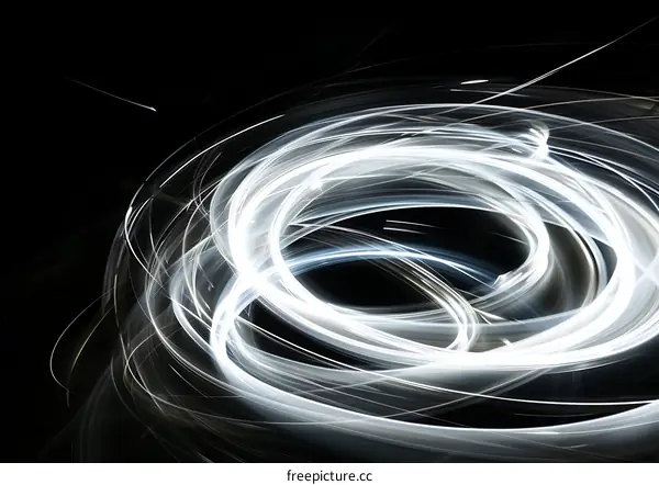 Abstract Spiral Light Trails on Black Background