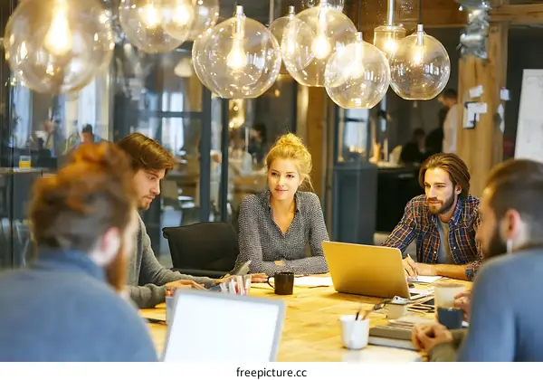 Coworking Space Team Meeting with Laptop