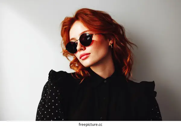 Stylish Redhead Woman in Sunglasses