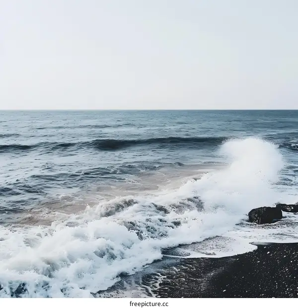Ocean Wave Crashing On Black Sand Beach