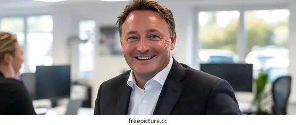 Smiling Businessman In Office