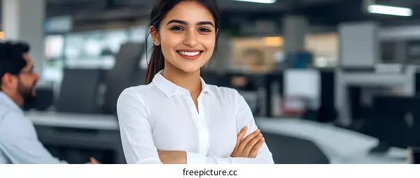 Smiling businesswoman standing in a modern office