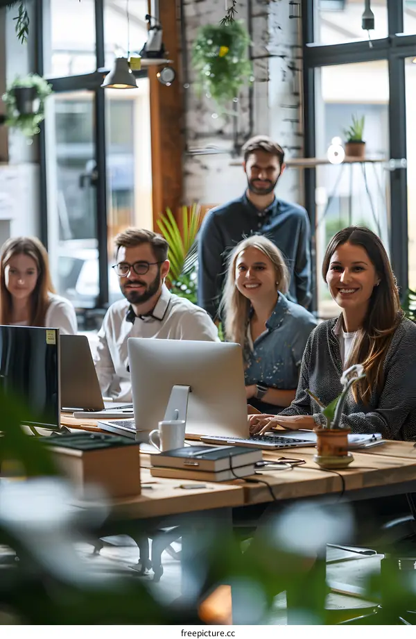 Smiling Team Members Working Together in a Modern Office