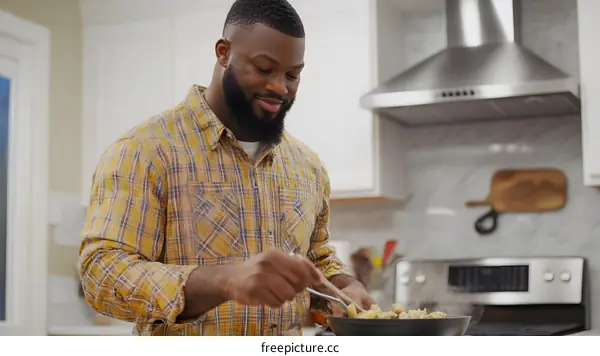 Black Man Cooking in Kitchen