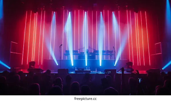 Stage with red and blue lights and a crowd