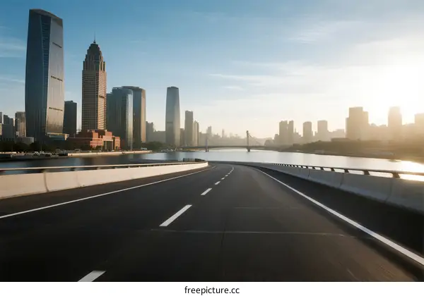 Modern city road with tall buildings and river view