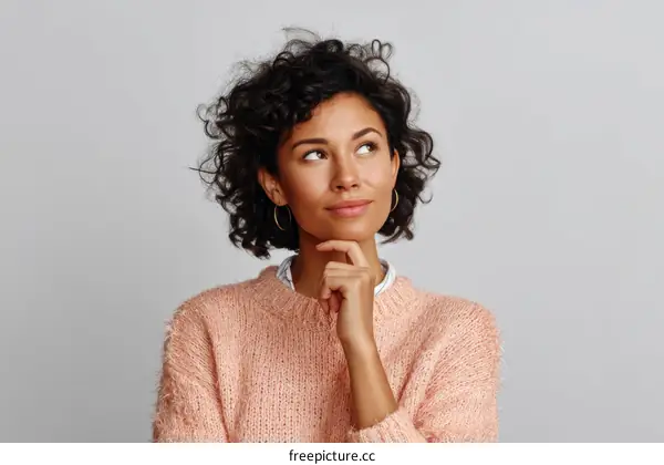 Thoughtful Woman in a Knitted Sweater