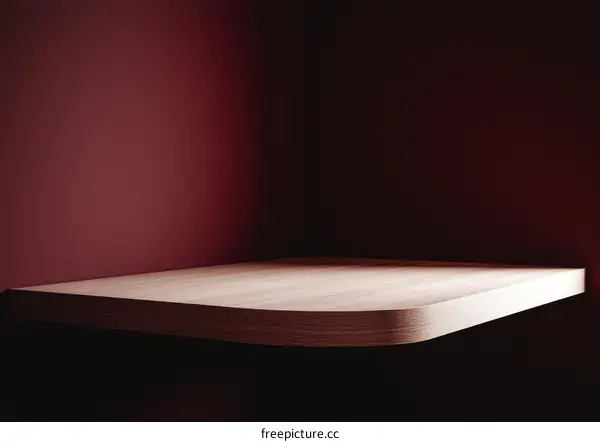 Empty Wooden Shelf Against Deep Red Wall