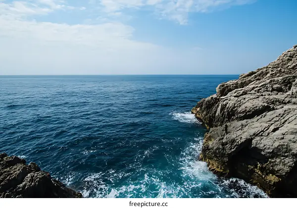 Rocky Coastline Meets the Azure Sea