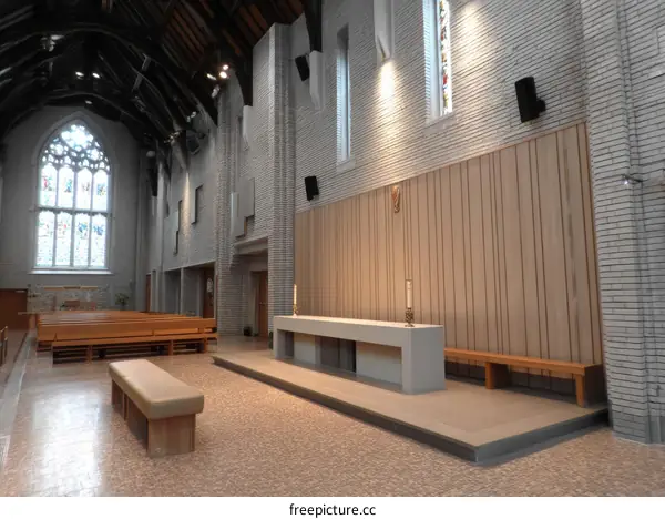 Modern Church Interior with Stained Glass Window