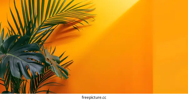 Green Palm Leaves on Yellow Background