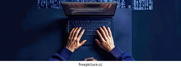 Hacker Working Late Night on Laptop