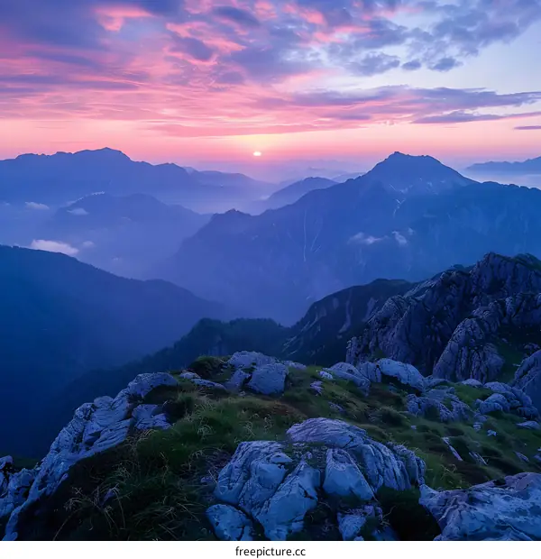 mountain range at sunset with purple sky