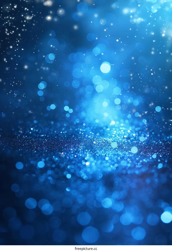 Blue glitter sparkles with a bright light in the center