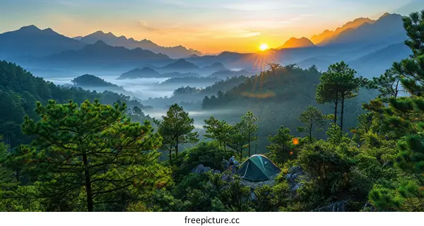 Sunrise Over Majestic Mountains: A Breathtaking Campsite View
