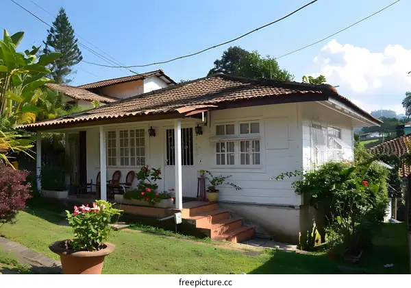 White Wooden House with Brown Roof in a Garden